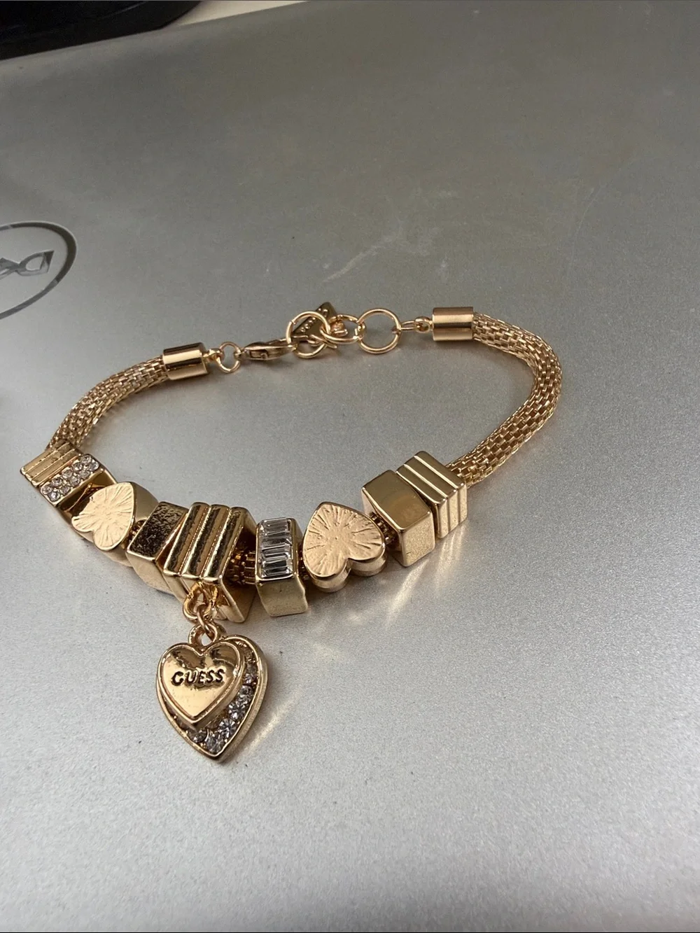 Gold color Guess mesh. Charm bracelet 8”.   NWOT.  Beautiful